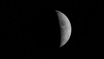 grayscale photo of moon in dark night sky